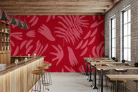 Botanical wall mural with red and pink color contrast and leaf design