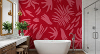 Red botanical wall mural in a bathroom with pink leaf shapes