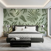 Botanical abstract wall mural in a bedroom with sage Shapes and olive tones