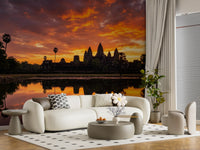 Landscape wall mural with water reflection and dramatic sunset clouds