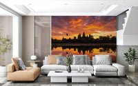Nature reflection wall mural with orange sky and calm water surface