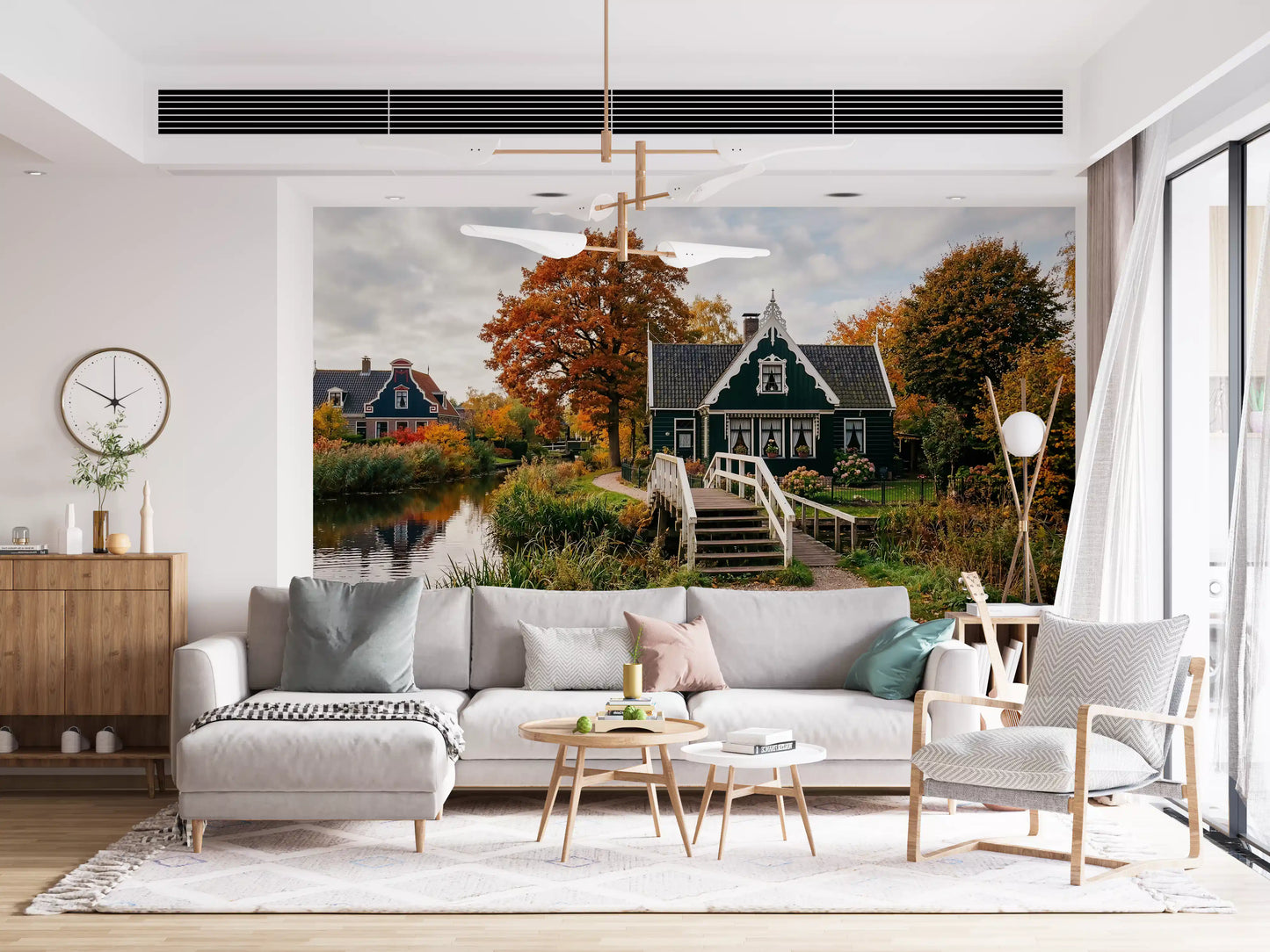 Living room setup with canal house mural and autumn landscape view