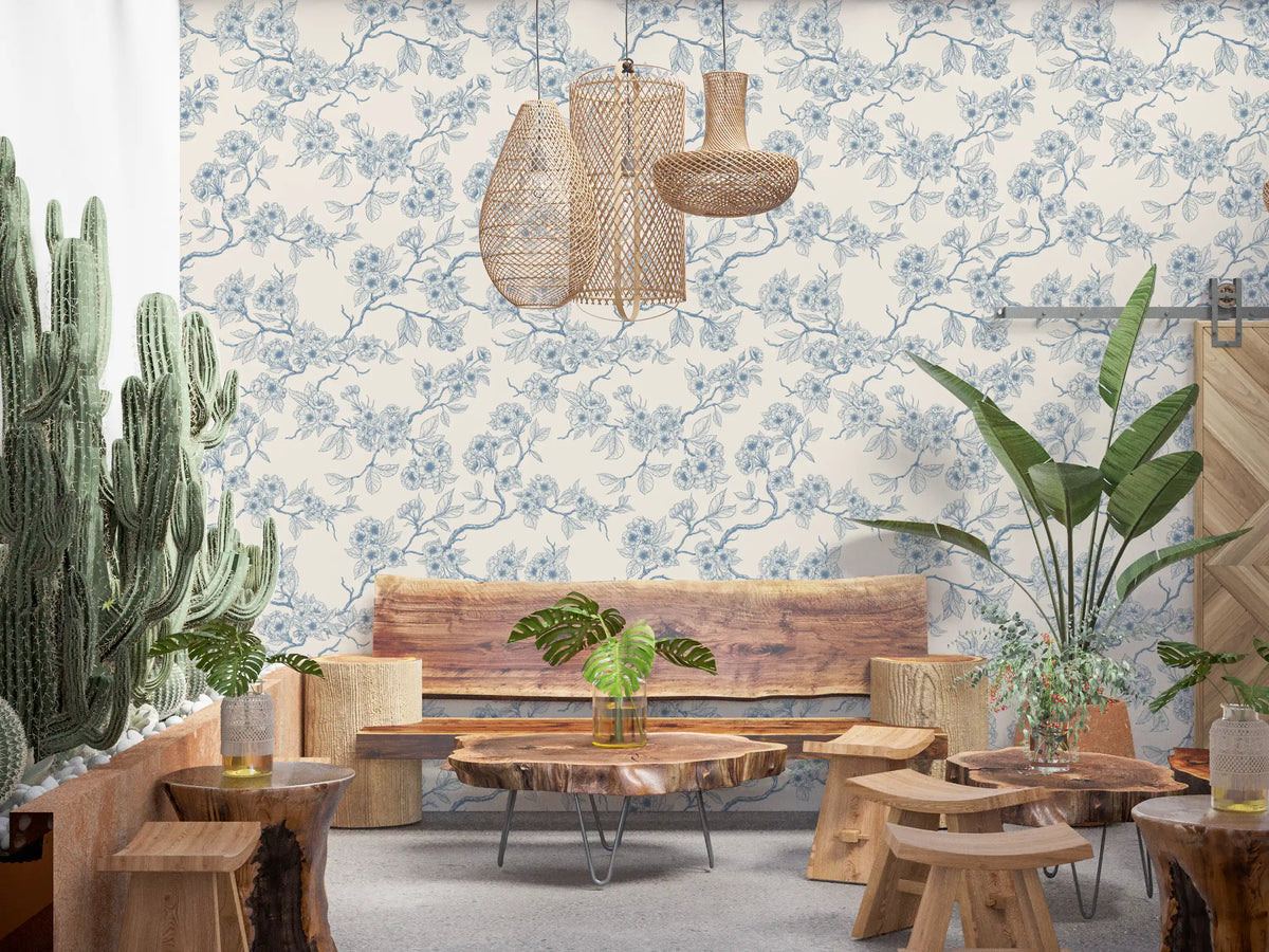 Blue line art wallpaper with cherry blossom branches and floral detailing