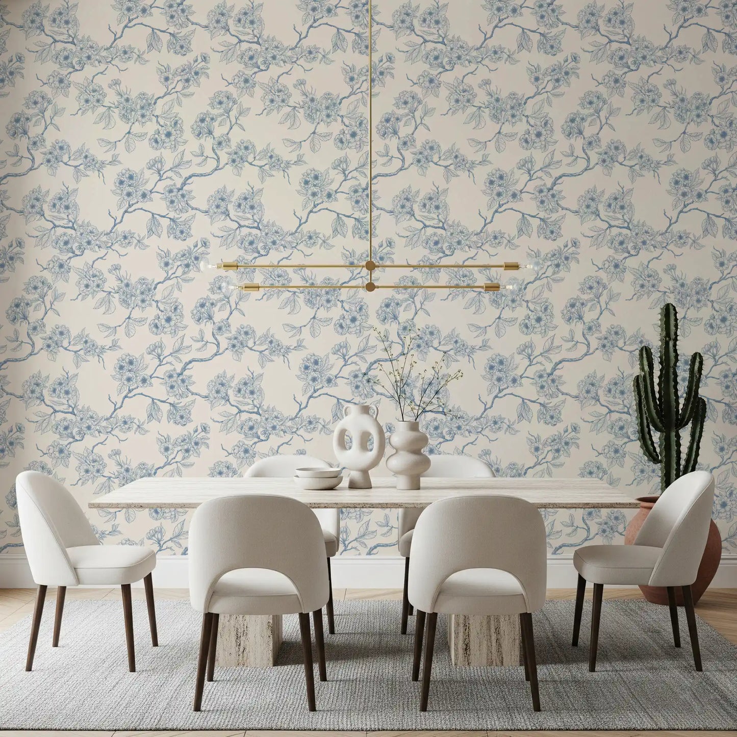Dining room setup with cherry blossom branch wallpaper in soft blue tones