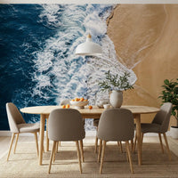Dining room wall mural featuring ocean meets shore waves and golden sand sweep below