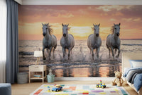 Nursery area wall mural with sunset horses racing through bright shoreline water spray