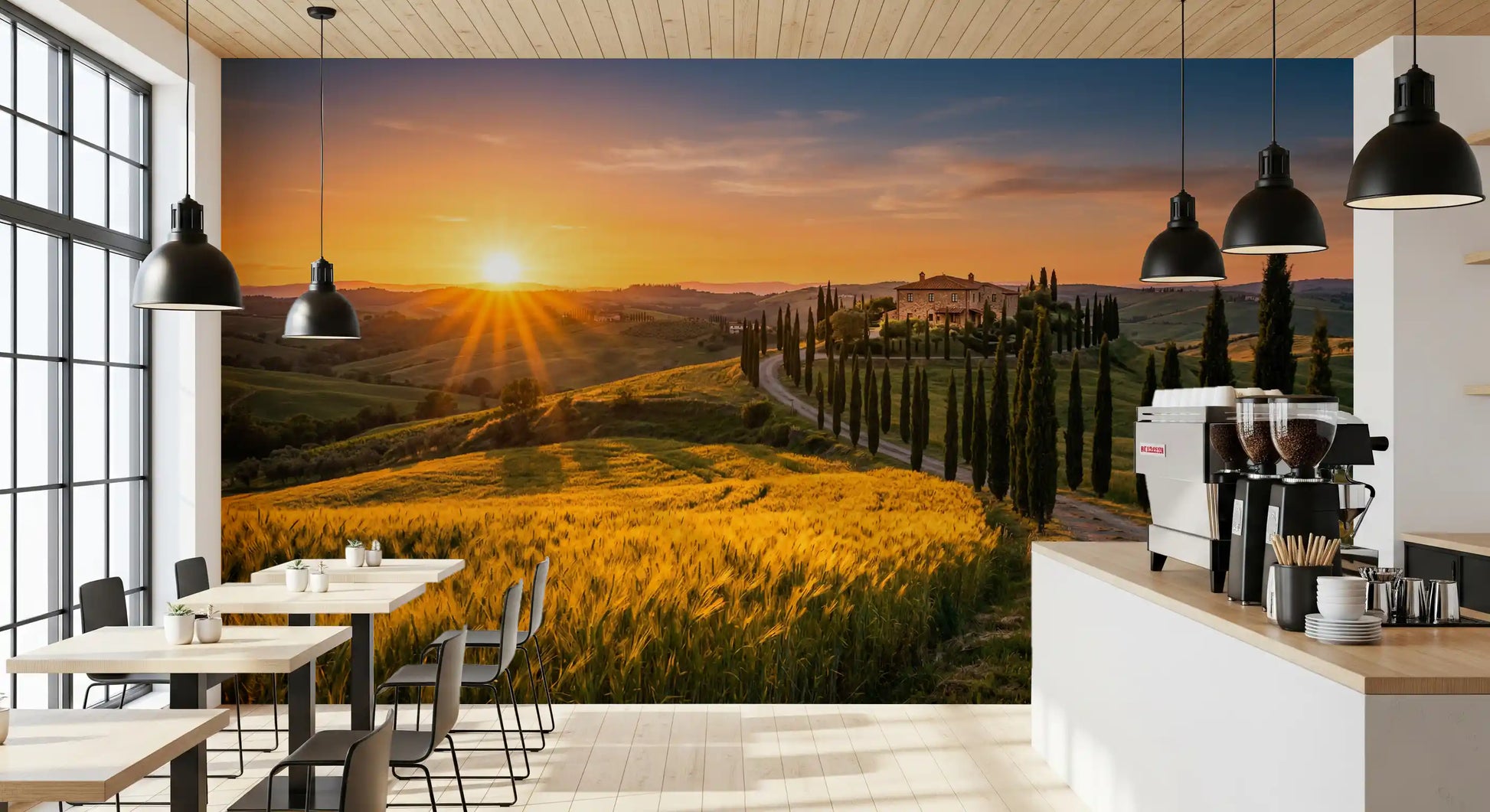 The café & restaurant, a Tuscan golden hour wall mural frames the villa and cypress road