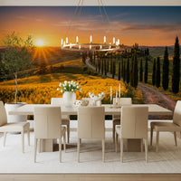 Dining room wall mural sets a Tuscan golden hour mood with winding cypress road view