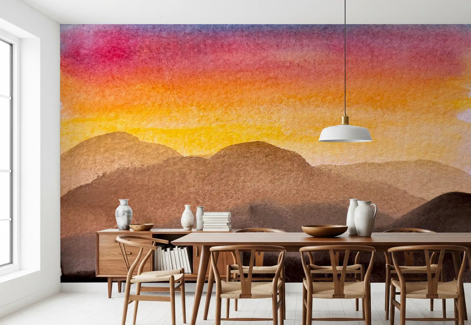 Watercolor Sunset wall mural in a dining room with layered mountain silhouettes