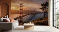 Coastal sunset bridge wall mural bringing warmth to a relaxed lounge interior