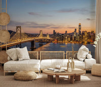 Living room wall mural with sunset skyline and bridge lights