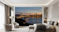 Guest room wall mural with urban skyline and lit bridge