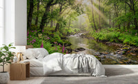 Bedroom wall featuring Sunlit Woodland Stream wall mural with river