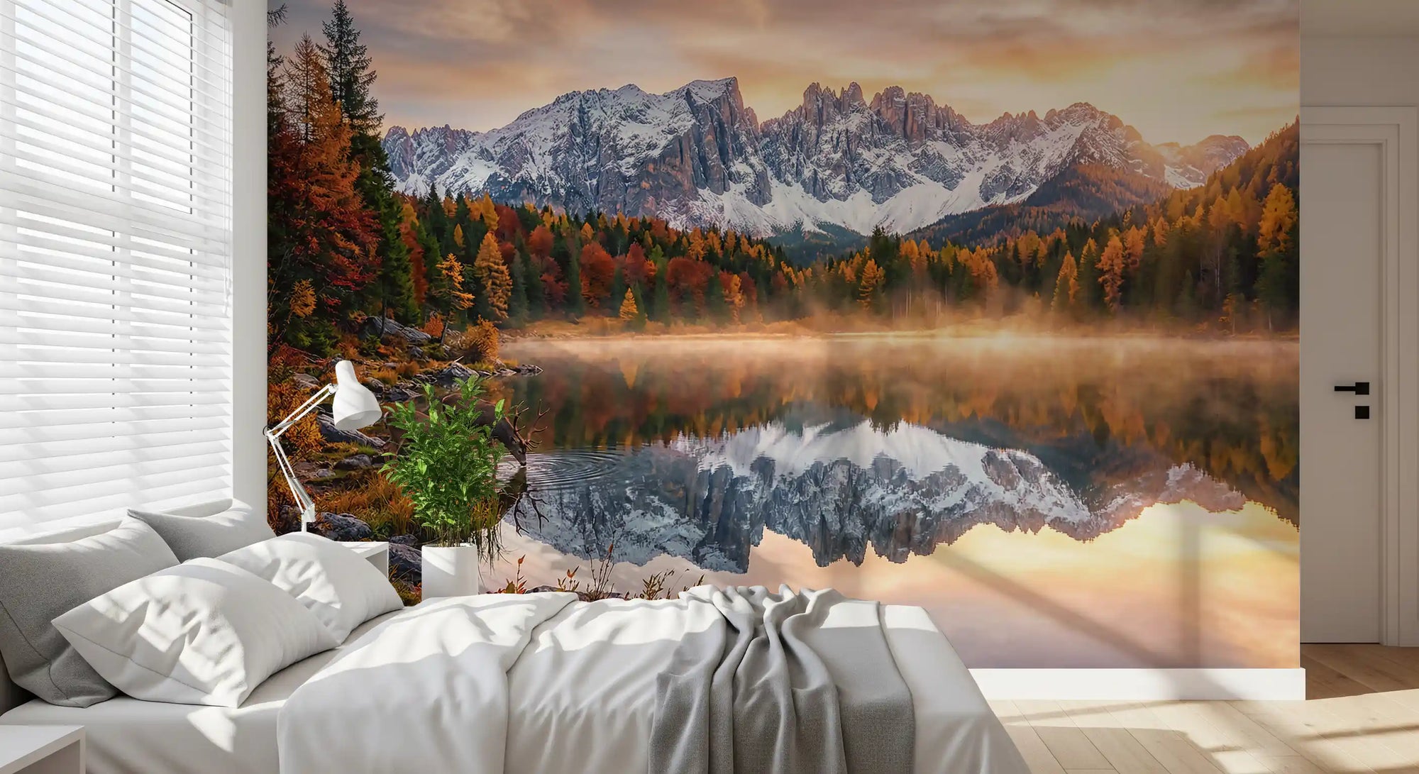 In a bedroom, Alpine Autumn Serenity wall mural shows forest reflection and peaks