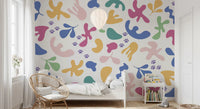 Boys room styled in Whimsical Shapes wall mural with pink blue curved motifs