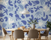 Soft blue Periwinkle wall mural with playful cutout-inspired pattern