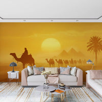 Desert caravan wall mural with sunlit dunes and hazy background