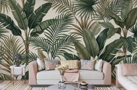 Living room with Lush Tropical Foliage wall mural and palm leaf artwork