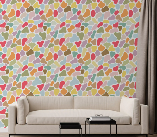 Living room wall in Playful Pebble Palette wallpaper with pastel shapes
