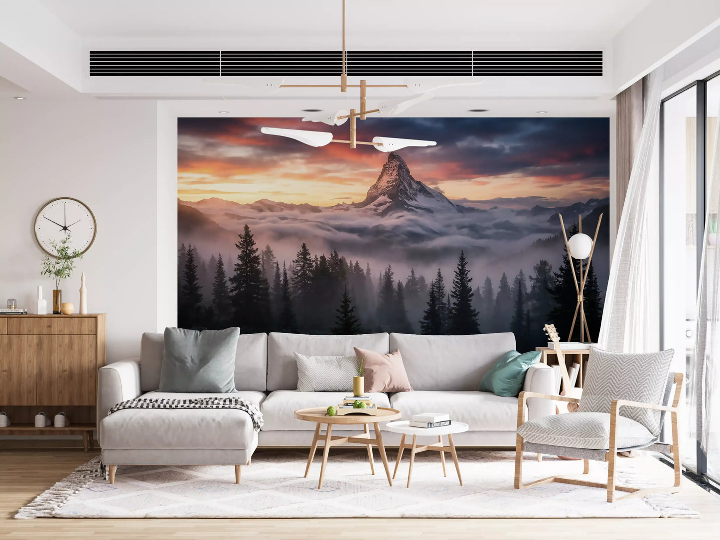 Mountain scenery wall mural featuring alpenglow light and cloud-covered ridges