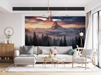 Mountain scenery wall mural featuring alpenglow light and cloud-covered ridges