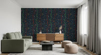 Bird branch wallpaper with scattered leaves across a deep midnight base