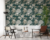 Deep pine-green wallpaper showing layered Deco chrysanthemum motifs
