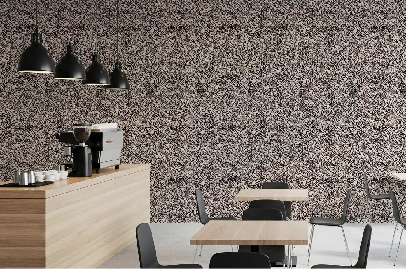 Pebble mosaic wallpaper lining the Cafe -dining area in deep espresso and cream tones