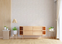 Cream and beige pebble dust abstract wallpaper showing scattered dot clusters