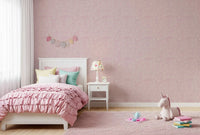 Pebble Bloom wallpaper wraps a kids' room in pastel pink and cream dots