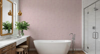Muted blush Pebble Bloom wallpaper spreading across this bathroom 