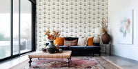Living room clad in minimalist tulip wallpaper with olive palm fans