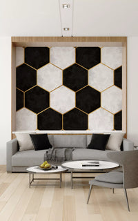 Black and gold honeycomb wall mural anchoring a refined Living room setting