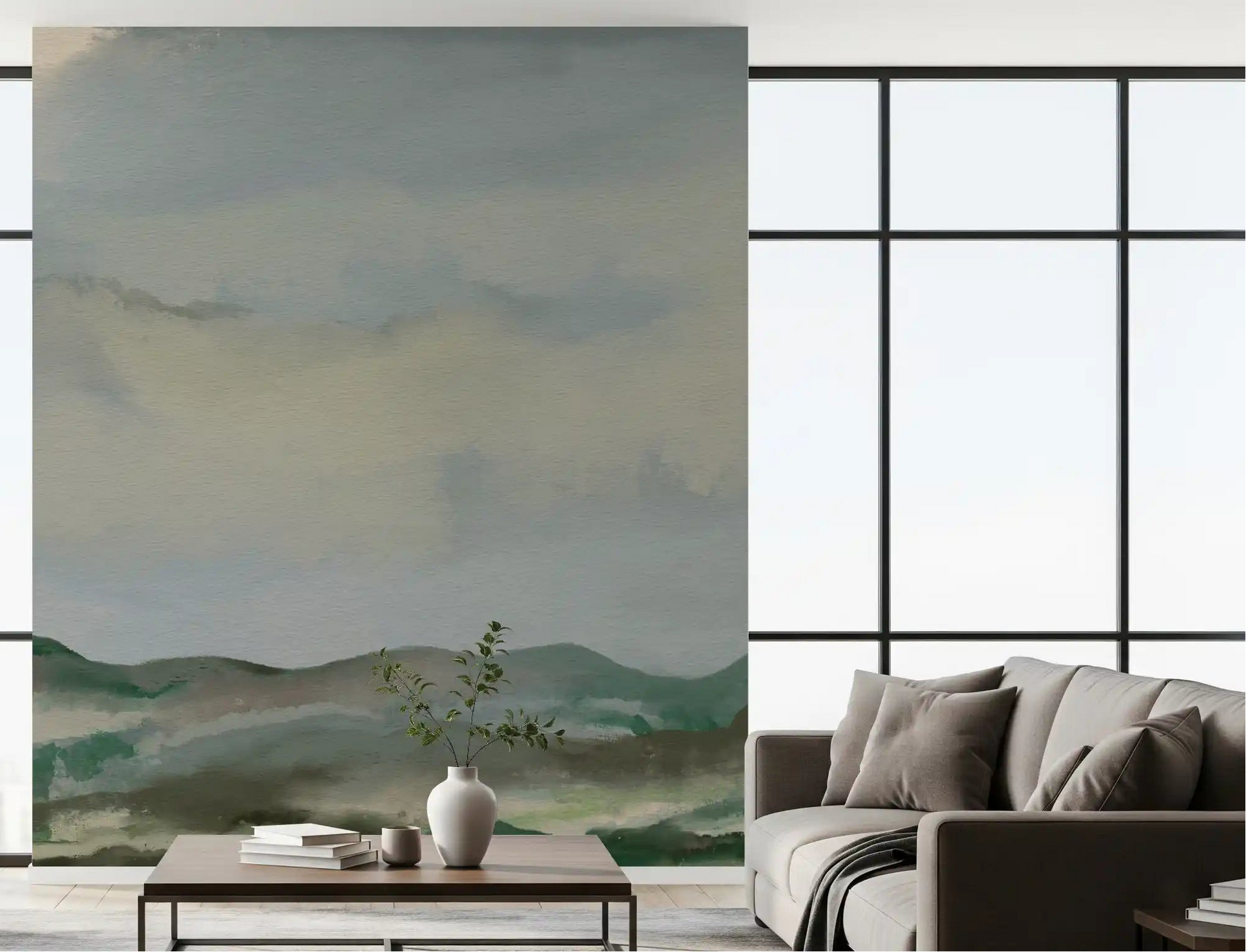 Modern lounge showing painterly hillside wall mural with misty sky tones