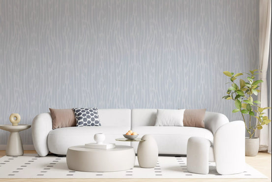Living room with Subtle Gray Flow watercolor wallpaper in pale, airy tones.