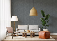 Cool greige tones from the moody strokes wallpaper define this calm, quiet Living room 