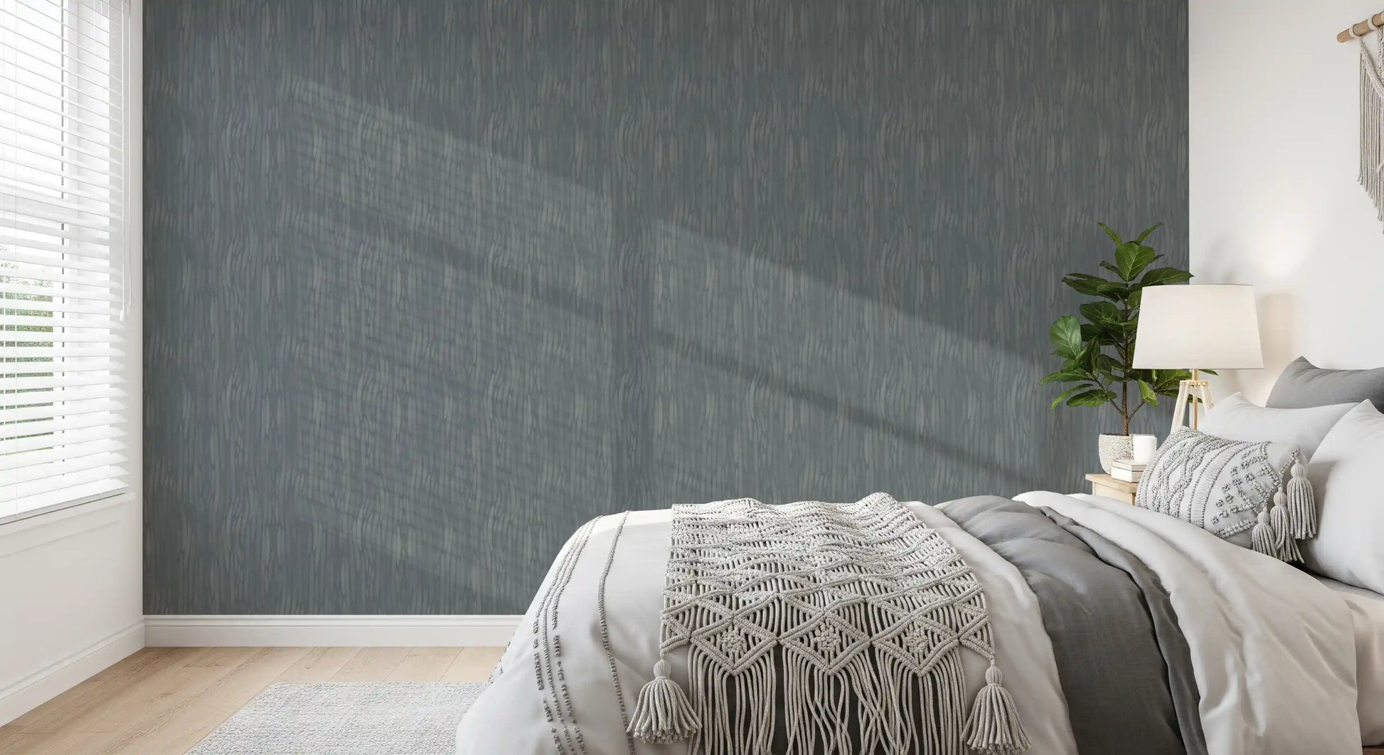 Repeating painterly waves shape the calm rhythm of this greige wallpaper