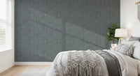 Repeating painterly waves shape the calm rhythm of this greige wallpaper