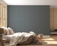 Calm daylight fills a bedroom paired with the whispering greige wallpaper