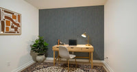 A drift of slate-gray lines pulls the eye through the moody strokes wallpaper