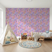 Playroom area styled around the multicolor pattern wallpaper in bright watercolour tones
