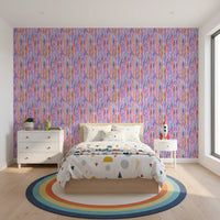 Toddler's room holding the multicolor rainbow pattern wallpaper as a colourful backdrop