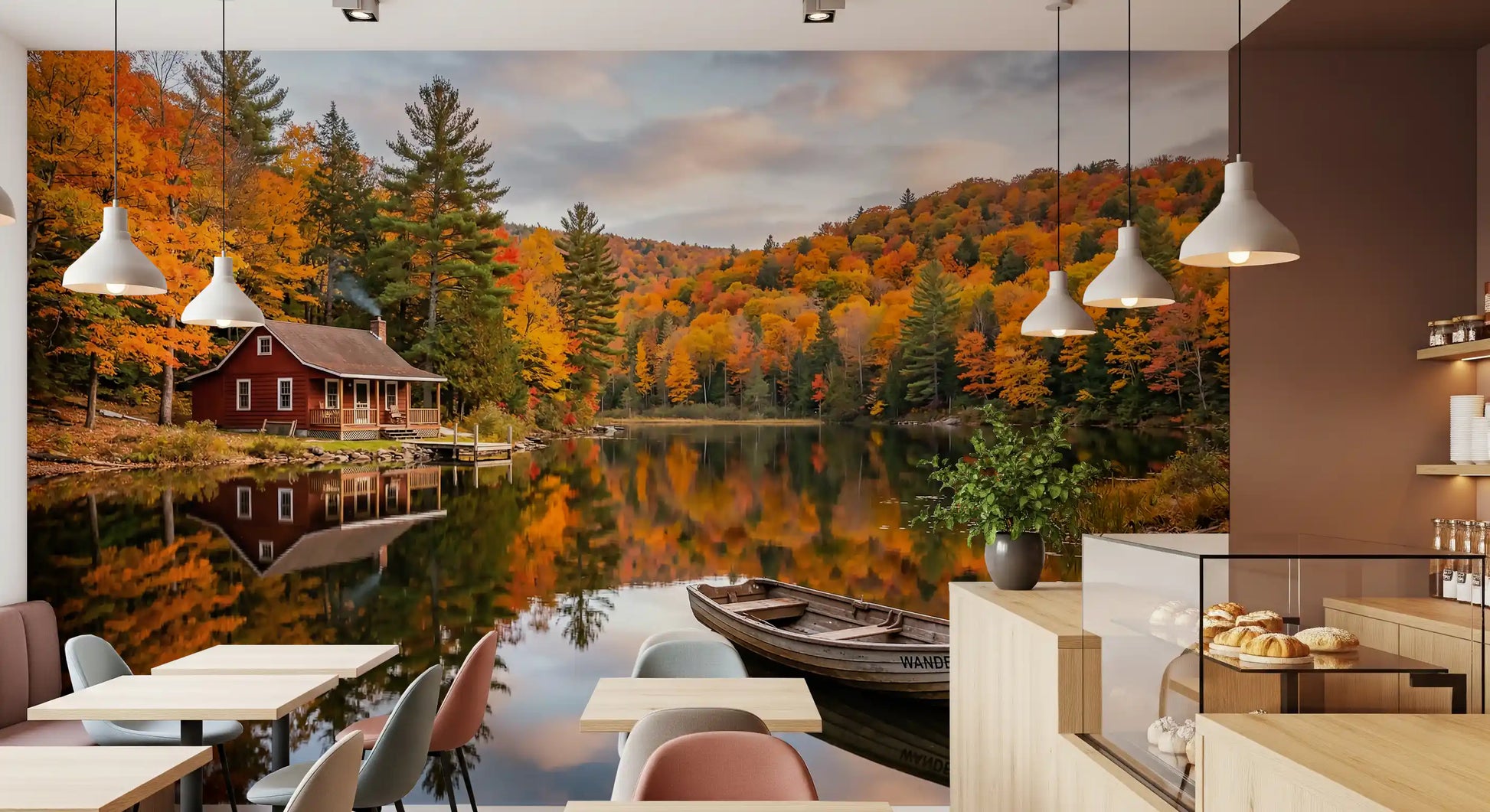Autumn cabin lake wall mural lining a Café in warm fall amber tones