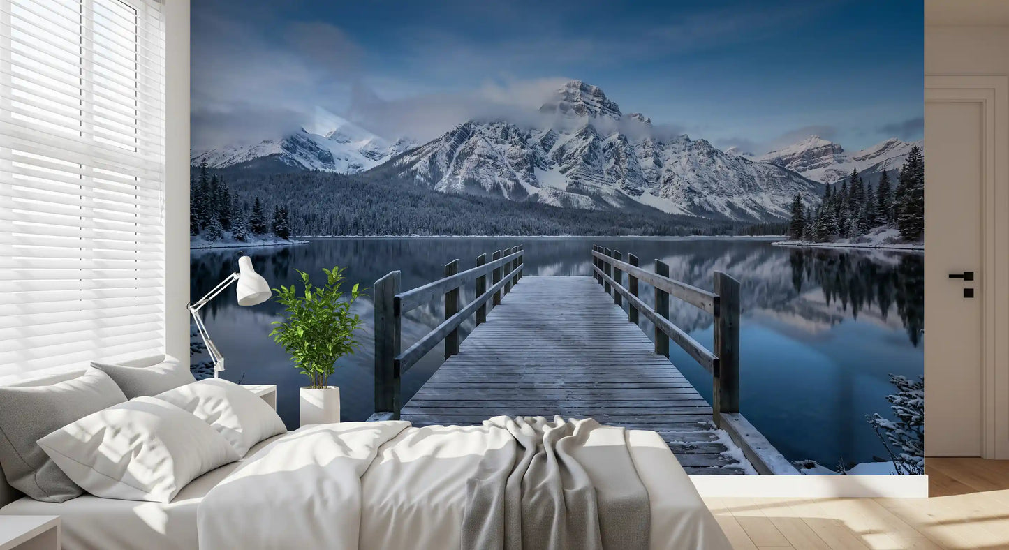 Cloud-shrouded mountain peak in the Winter Serenity wall mural above still water
