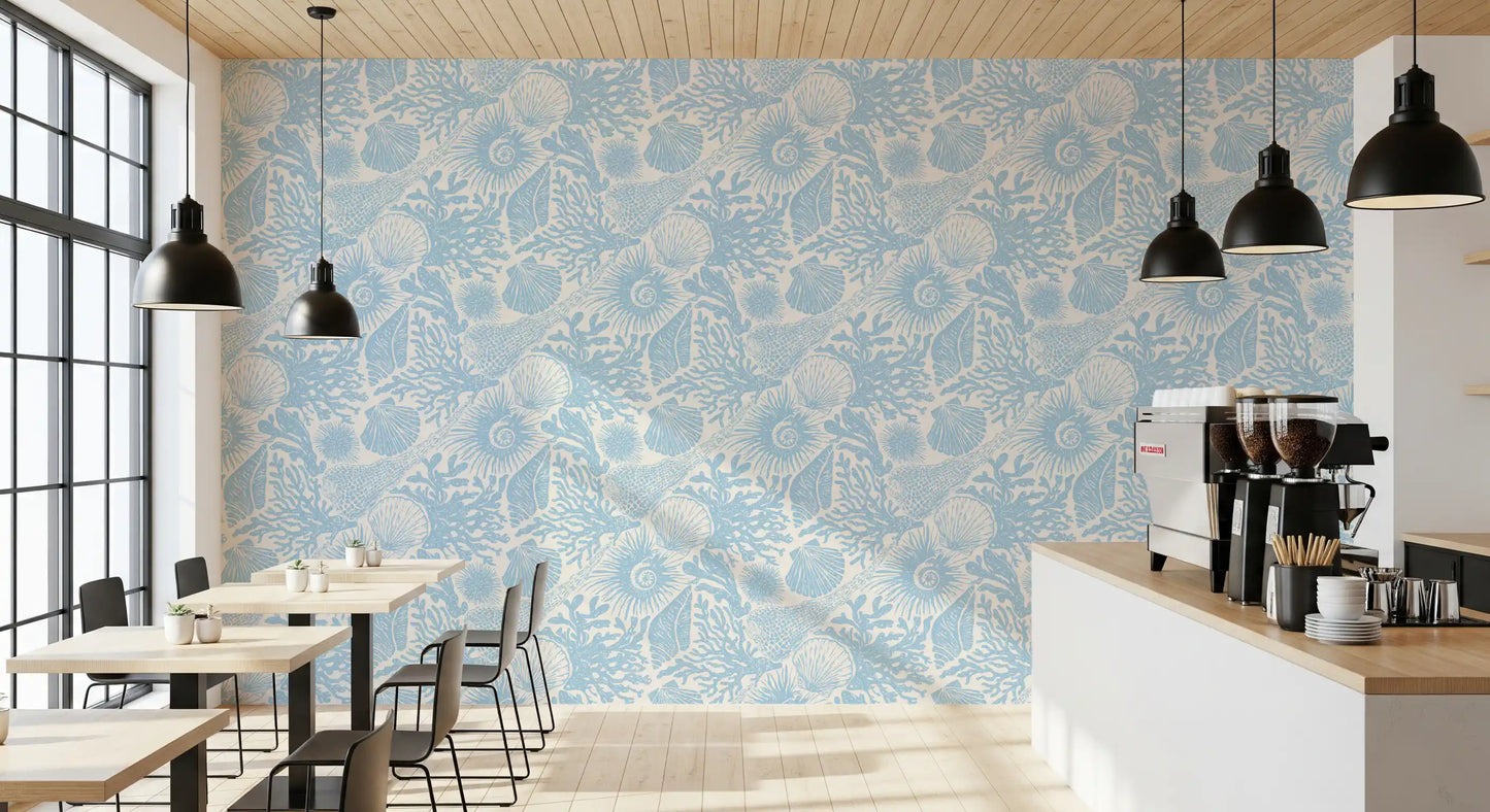Seashell coral wallpaper in a Café in powder blue on a cream ground