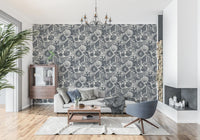 Navy seashell wallpaper along a living room feature surface in cream and blue