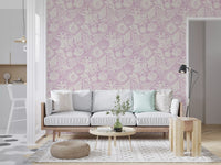Warm purple ground and cream shell forms in the Boho Seashell Lavender wallpaper