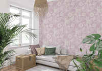 Coastal coral seashell wallpaper lining a sitting room in soft lavender tones