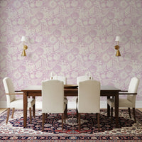Illustrated seashell wallpaper filling a dining room in lavender and cream tones