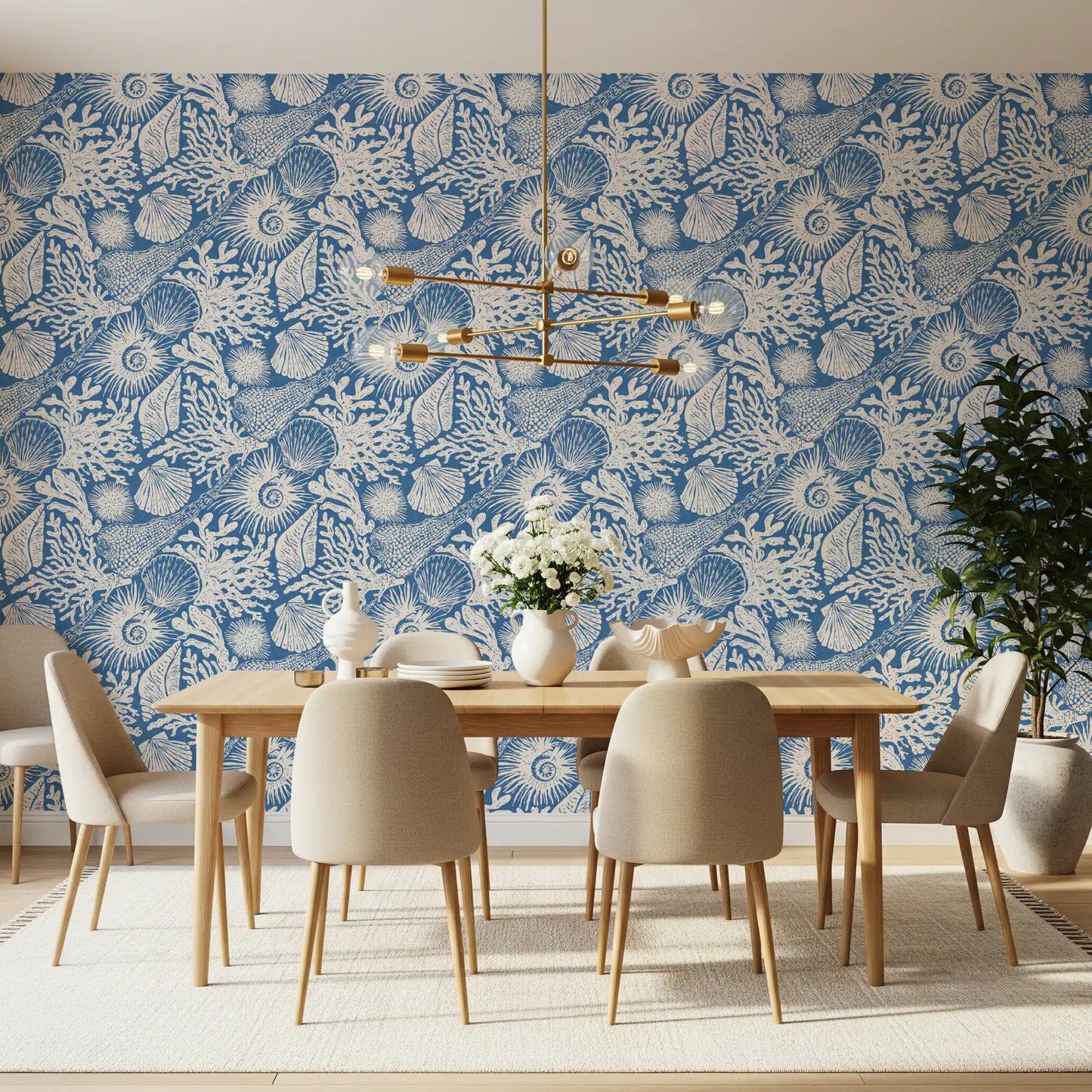Detailed sea urchin and fan shell forms in the bright blue coastal wallpaper